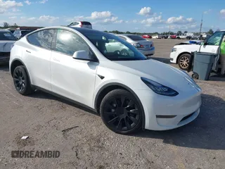 2023 Tesla Model Y Long Range z VIN 7SAYGDEE0PA128888, wystawiony jako IAAI lot #41410085 z przebiegiem 12 578 mil mil oraz . Historia ofert i sprzedaży dostępna na DreamBid. Obrazek 1.