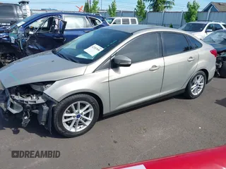 2015 Ford Focus SE z VIN 1FADP3F29FL206003, wystawiony jako IAAI lot #42187898 z przebiegiem 149 560 mil mil oraz . Historia ofert i sprzedaży dostępna na DreamBid. Obrazek 2.