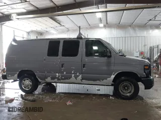 2014 Ford Econoline Cargo Commercial with VIN 1FTNE2EW4EDA64221, listed as a IAAI auction lot 41628147 with 190,018 mi miles and . Bid and sale history available at DreamBid. Image 13.
