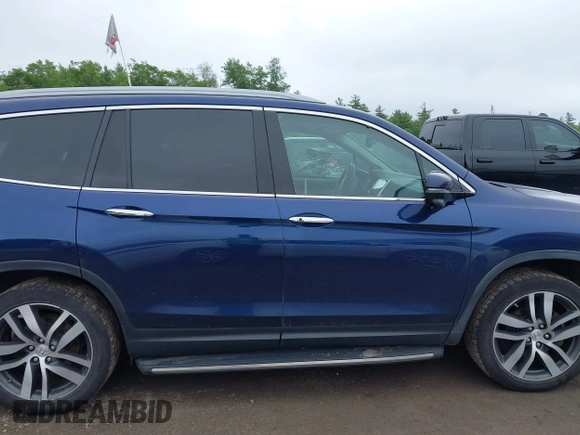 2017 Honda Pilot Touring with VIN 5FNYF6H99HB093136, listed as a IAAI auction lot 42507326 with 125,579 mi miles and . Bid and sale history available at DreamBid. Image 13.