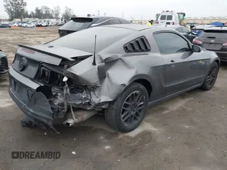 2013 Ford Mustang V6 with VIN 1ZVBP8AM6D5241569, listed as a IAAI auction lot 41884583 with 100,700 mi miles. Bid and sale history available at carsss.com. Image 4.