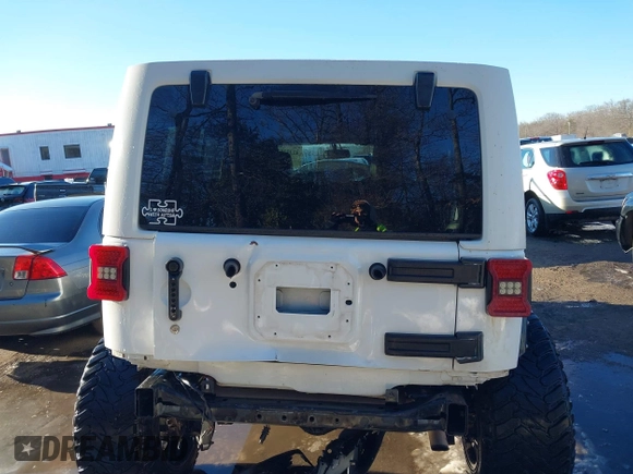 2014 Jeep Wrangler Unlimited Sahara with VIN 1C4HJWEG2EL273813, listed as a IAAI auction lot 41311011 with 96,104 mi miles. Bid and sale history available at carsss.com. Image 16.