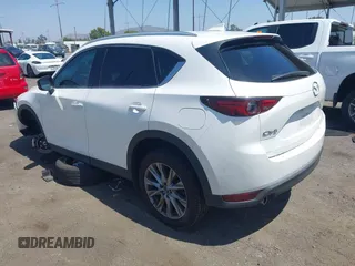 2020 Mazda CX-5 Grand Touring with VIN JM3KFADM9L0821930, listed as a IAAI auction lot 42549986 with 29,929 mi miles and . Bid and sale history available at DreamBid. Image 3.