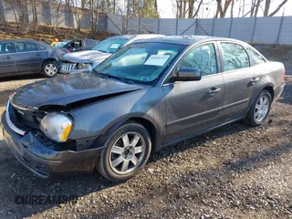 2005 Ford Five Hundred SE z VIN 1FAFP231X5G145153, wystawiony jako IAAI lot #42059747 z przebiegiem 59 114 mil mil oraz . Historia ofert i sprzedaży dostępna na DreamBid. Obrazek 2.