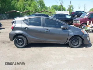 2015 Toyota Prius One z VIN JTDKDTB35F1107411, wystawiony jako IAAI lot #42159414 z przebiegiem 122 258 mil mil oraz . Historia ofert i sprzedaży dostępna na DreamBid. Obrazek 13.