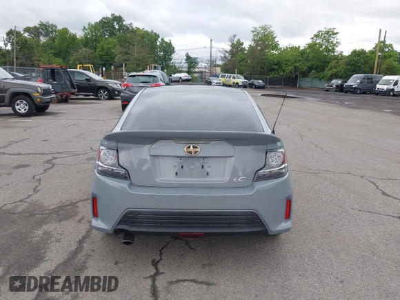 2014 Scion tC z VIN JTKJF5C71E3081033, wystawiony jako IAAI lot #42333111 z przebiegiem 144 124 mil mil oraz . Historia ofert i sprzedaży dostępna na DreamBid. Obrazek 16.