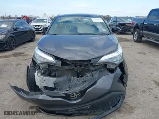 2021 Toyota C-HR LE with VIN JTNKHMBX9M1118773, listed as a IAAI auction lot 41115157 with 57,289 mi miles. Bid and sale history available at carsss.com. Image 12.