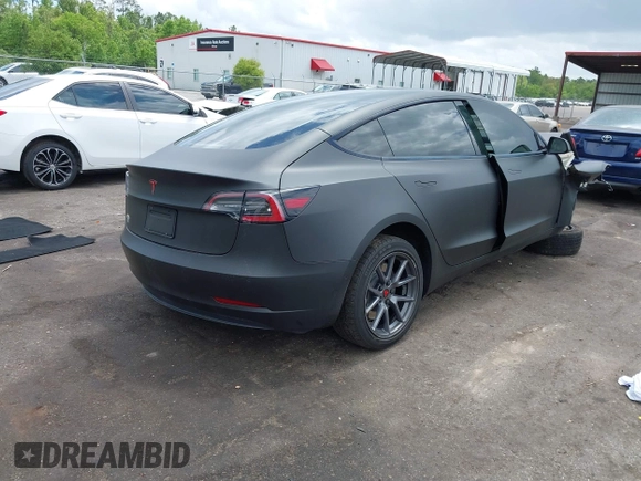2022 Tesla Model 3 with VIN 5YJ3E1EA3NF287512, listed as a IAAI auction lot 42000557 with 77,619 mi miles. Bid and sale history available at carsss.com. Image 4.
