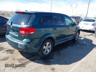 2009 Dodge Journey SXT with VIN 3D4GG57V09T170094, listed as a IAAI auction lot 41867577 with 122,831 mi miles. Bid and sale history available at carsss.com. Image 4.