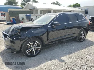 2018 Volvo XC60 Momentum z VIN LYV102RK6JB083622, wystawiony jako Copart lot #56909505 z przebiegiem 89 197 mil mil oraz Szkoda całkowita • Salvage title. Historia ofert i sprzedaży dostępna na DreamBid. Obrazek 1.