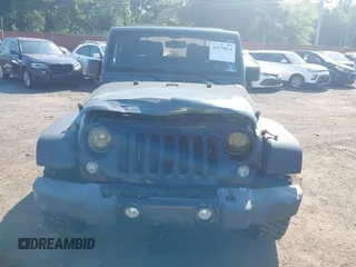 2015 Jeep Wrangler Freedom Edition with VIN 1C4AJWAG1FL714002, listed as a IAAI auction lot 42579024 with 98,732 mi miles and . Bid and sale history available at DreamBid. Image 12.