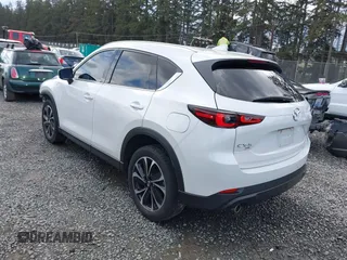 2023 Mazda CX-5 2.5 S Premium Plus Package with VIN JM3KFBEM3P0236481, listed as a IAAI auction lot 41815369 with 34,679 mi miles. Bid and sale history available at carsss.com. Image 3.
