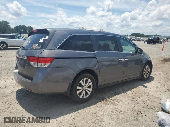 2014 Honda Odyssey EX-L with VIN 5FNRL5H62EB112280, listed as a Copart auction lot 60138645 with 167,657 mi miles and Salvage title. Bid and sale history available at DreamBid. Image 3.