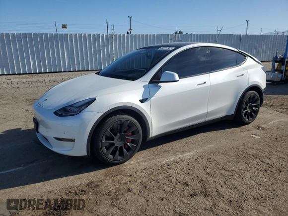 2022 Tesla Model Y Long Range with VIN 7SAYGDEE1NF339663, listed as a Copart auction lot 49771965 with 33,734 mi miles and Salvage Title. Bid and sale history available at carsss.com. Image 1.