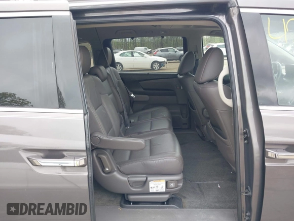 2013 Honda Odyssey Touring with VIN 5FNRL5H94DB013310, listed as a IAAI auction lot 42079565 with 128,622 mi miles and . Bid and sale history available at carsss.com. Image 8.