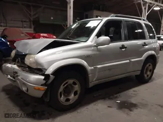 2002 Suzuki Grand Vitara JLX with VIN JS3TD62V324161291, listed as a IAAI auction lot 41577344 with 164,658 mi miles. Bid and sale history available at carsss.com. Image 2.