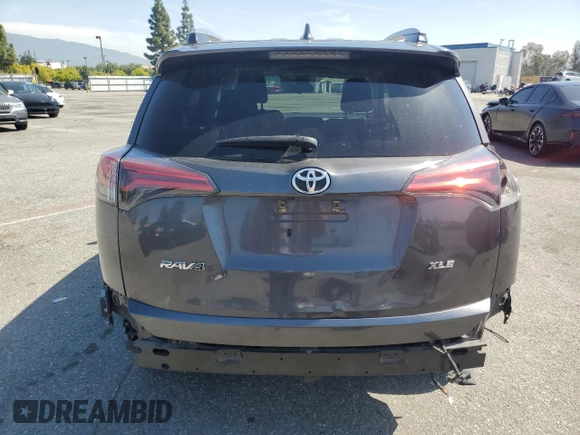 2018 Toyota RAV4 XLE with VIN 2T3WFREVXJW439401, listed as a Copart auction lot 52359275 with 148,274 mi miles and Salvage Title. Bid and sale history available at carsss.com. Image 6.