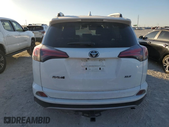 2018 Toyota RAV4 XLE with VIN JTMWFREV7JJ742974, listed as a Copart auction lot 41957735 with 87,005 mi miles and Salvage Title. Bid and sale history available at DreamBid. Image 6.