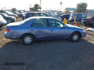 2000 Toyota Camry CE with VIN 4T1BG22K6YU000857, listed as a IAAI auction lot 42118645 with 244,448 mi miles and . Bid and sale history available at carsss.com. Image 13.