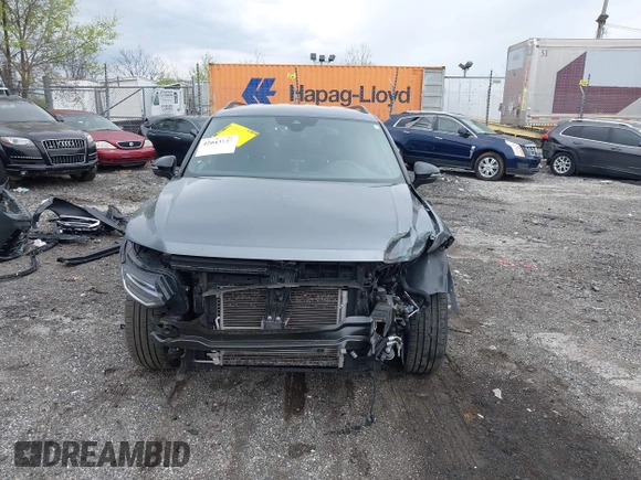 2022 Volkswagen Tiguan SE R-Line Black z VIN 3VVCB7AX9NM014741, wystawiony jako IAAI lot #42043123 z przebiegiem 71 777 mil mil oraz . Historia ofert i sprzedaży dostępna na DreamBid. Obrazek 6.