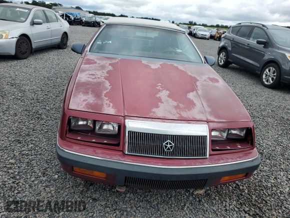 1989 Chrysler LeBaron z VIN 1C3XJ45J8KG223051, wystawiony jako Copart lot #75115464 z przebiegiem 27 923 mil mil oraz Szkody całkowita. Historia ofert i sprzedaży dostępna na DreamBid. Obrazek 5.