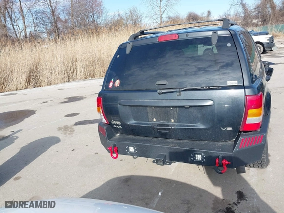 2004 Jeep Grand Cherokee Limited with VIN 1J4GW58N74C120435, listed as a IAAI auction lot 41815094 with 193,056 mi miles. Bid and sale history available at carsss.com. Image 16.