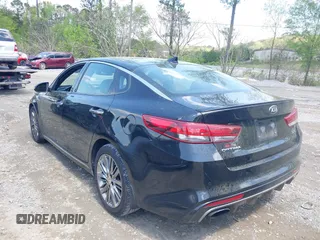 2016 Kia Optima SXL Turbo with VIN 5XXGV4L23GG117486, listed as a IAAI auction lot 41998300 with 142,477 mi miles. Bid and sale history available at carsss.com. Image 14.