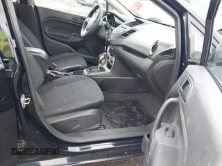 2017 Ford Fiesta SE z VIN 3FADP4BJ4HM153649, wystawiony jako IAAI lot #42037378 z przebiegiem 78 540 mil mil oraz . Historia ofert i sprzedaży dostępna na DreamBid. Obrazek 5.