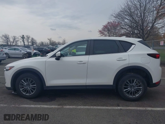 2017 Mazda CX-5 Touring with VIN JM3KFACL5H0189296, listed as a IAAI auction lot 42042328 with 60,208 mi miles and . Bid and sale history available at carsss.com. Image 14.