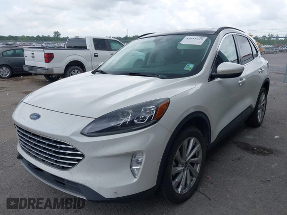 2021 Ford Escape Titanium with VIN 1FMCU9J93MUA36648, listed as a IAAI auction lot 42055229 with 122,864 mi miles and . Bid and sale history available at carsss.com. Image 2.