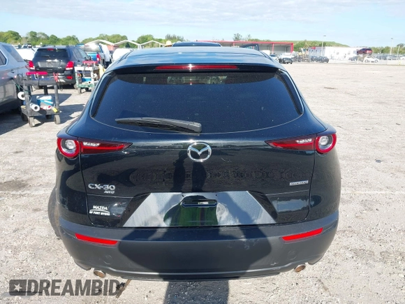 2023 Mazda CX-30 S Select with VIN 3MVDMBBM9PM508958, listed as a IAAI auction lot 42009029 with 21,219 mi miles and . Bid and sale history available at DreamBid. Image 17.