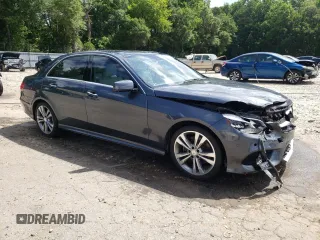 2014 Mercedes-Benz E 350 Sport with VIN WDDHF5KB7EB038257, listed as a Copart auction lot 61251595 with 110,814 mi miles and Salvage title. Bid and sale history available at DreamBid. Image 4.
