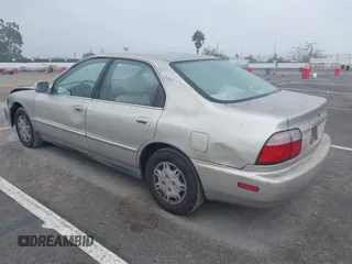 1997 Honda Accord Value with VIN 1HGCD568XVA184006, listed as a IAAI auction lot 41818518 with 276,230 mi miles and . Bid and sale history available at carsss.com. Image 3.