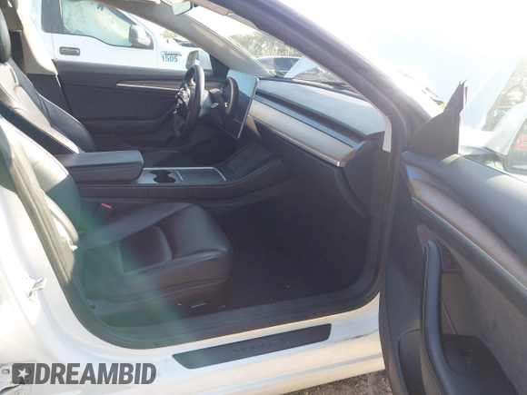 2023 Tesla Model 3 with VIN 5YJ3E1EA9PF557880, listed as a IAAI auction lot 42481413 with 40,582 mi miles and . Bid and sale history available at DreamBid. Image 5.