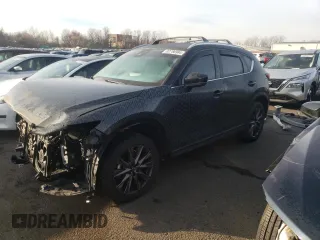 2021 Mazda CX-5 Signature with VIN JM3KFBEY2M0345187, listed as a Copart auction lot 82786984 with 98,014 mi miles and Salvage Title. Bid and sale history available at carsss.com. Image 1.