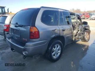 2005 GMC Envoy SLT with VIN 1GKDS13SX52322725, listed as a Copart auction lot 82032674 with 249,288 mi miles and Salvage Title. Bid and sale history available at carsss.com. Image 3.