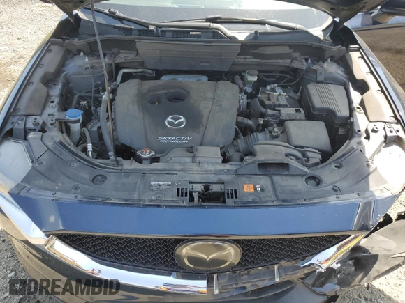 2018 Mazda CX-5 Grand Touring with VIN JM3KFBDM8J0342272, listed as a Copart auction lot 61930115 with 119,727 mi miles and Salvage title. Bid and sale history available at DreamBid. Image 12.