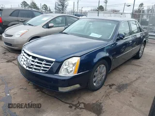 2009 Cadillac DTS 1SA z VIN 1G6KD57Y19U137656, wystawiony jako IAAI lot #41531439 z przebiegiem 103 151 mil mil oraz . Historia ofert i sprzedaży dostępna na DreamBid. Obrazek 2.