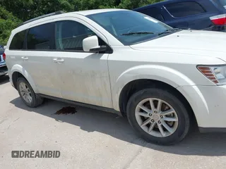 2017 Dodge Journey SXT z VIN 3C4PDCBG4HT590992, wystawiony jako IAAI lot #42378549 z przebiegiem 275 884 mil mil oraz . Historia ofert i sprzedaży dostępna na DreamBid. Obrazek 13.