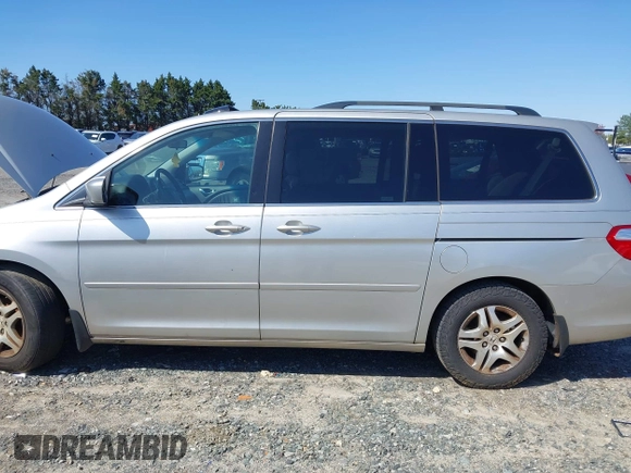2007 Honda Odyssey EX-L with VIN 5FNRL387X7B080906, listed as a IAAI auction lot 41910061 with 229,717 mi miles and . Bid and sale history available at DreamBid. Image 14.