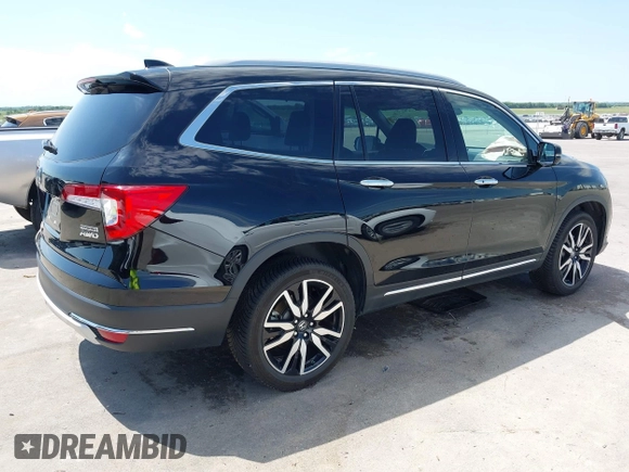 2019 Honda Pilot Touring 7-Passenger with VIN 5FNYF6H67KB031988, listed as a IAAI auction lot 42519588 with 41,368 mi miles and . Bid and sale history available at DreamBid. Image 4.