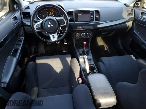 2014 Mitsubishi Lancer Evolution GSR z VIN JA32W8FV6EU018171, wystawiony jako Copart lot #77109934 z przebiegiem 83 467 mil mil oraz Tytuł czysty. Historia ofert i sprzedaży dostępna na DreamBid. Obrazek 8.