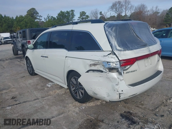 2014 Honda Odyssey Touring with VIN 5FNRL5H97EB127836, listed as a IAAI auction lot 41497413 with 174,914 mi miles and . Bid and sale history available at DreamBid. Image 3.