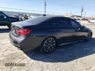 2019 BMW 7 Series 750i with VIN WBA7F0C56KGM25430, listed as a Copart auction lot 42048135 with 74,717 mi miles and Salvage title. Bid and sale history available at DreamBid. Image 3.