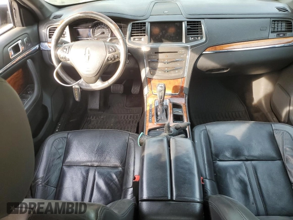 2014 Lincoln MKS with VIN 1LNHL9EK2EG610291, listed as a Copart auction lot 54544745 with 147,075 mi miles and Salvage Title. Bid and sale history available at carsss.com. Image 8.