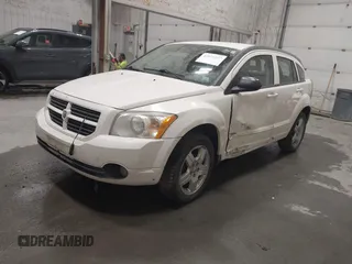 2009 Dodge Caliber SXT with VIN 1B3HB48A19D212690, listed as a IAAI auction lot 42076527 with 212,909 mi miles and . Bid and sale history available at carsss.com. Image 2.