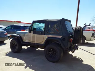 2005 Jeep Wrangler Sport with VIN 1J4FA49S45P345673, listed as a IAAI auction lot 41830128 with 139,432 mi miles. Bid and sale history available at carsss.com. Image 14.