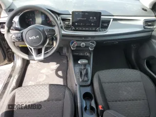 2023 Kia Rio LX with VIN 3KPA24AD7PE576869, listed as a Copart auction lot 50861285 with 18,044 mi miles and Salvage Title. Bid and sale history available at DreamBid. Image 8.