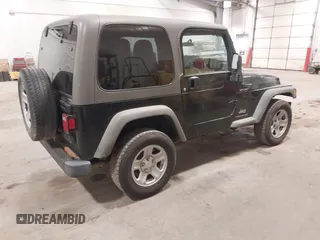 2006 Jeep Wrangler Sport Right Hand Drive with VIN 1J4F449S56P741328, listed as a IAAI auction lot 41476847 with 67,203 mi miles. Bid and sale history available at carsss.com. Image 4.
