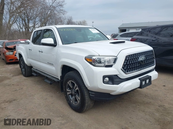 2018 Toyota Tacoma SR5 with VIN 3TMDZ5BN9JM051105, listed as a IAAI auction lot 41708034 with 98,000 mi miles and . Bid and sale history available at DreamBid. Image 1.